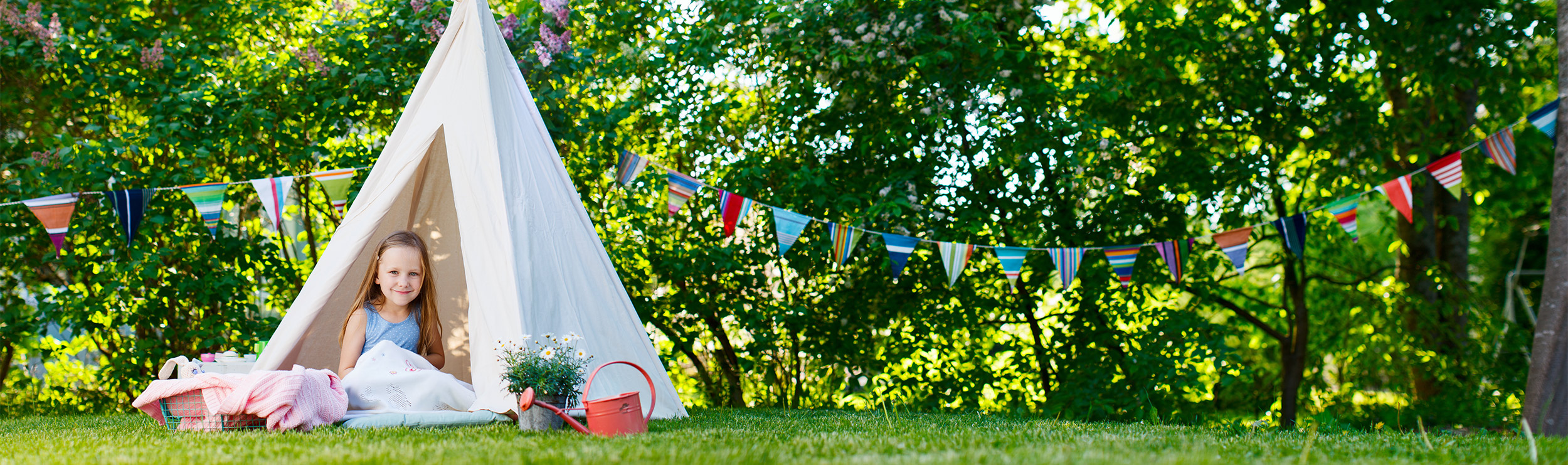 Girl in tent enjoying her mosquito-free backyard